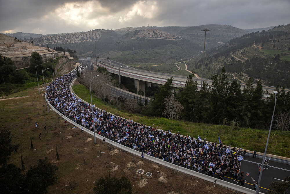 JERUSALEM, ISRAEL - MARCH 2, 2024 - Families of the hostages held in Gaza and supporters approach Jerusalem on the final day of a four-day march from areas attacked on October 7 in southern Israel to Jerusalem, on March 2, 2024. Amid fraught negotiations between Israel and Hamas over conditions for a ceasefire, the families of the hostages held the march to keep attention focused on the plight of their loved ones still in captivity and to further pressure the Israeli government to secure a deal that would release them. (Tamir Kalifa)