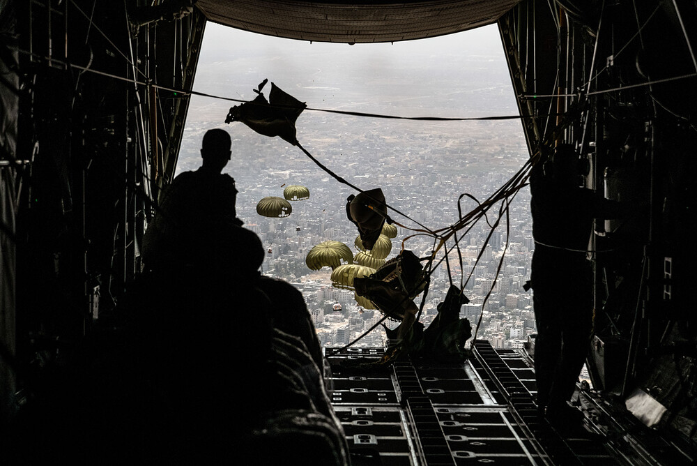 PALESTINE. Gaza. April 23, 2024. Humanitaria aid being dropped from a Jordanian Air Force plane flying over northern Gaza.