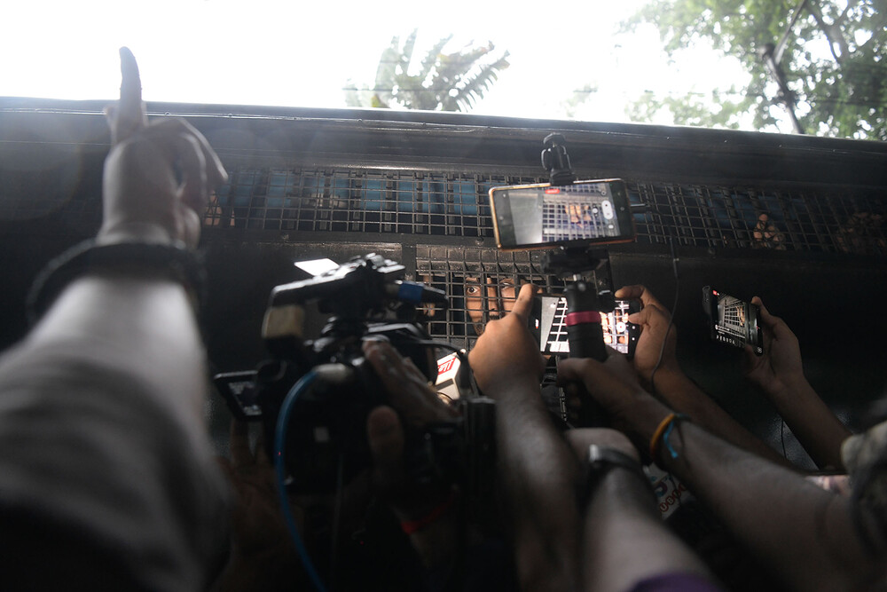 A detained protester is seen being interviewed by the media A detained protester is seen being interviewed by the media