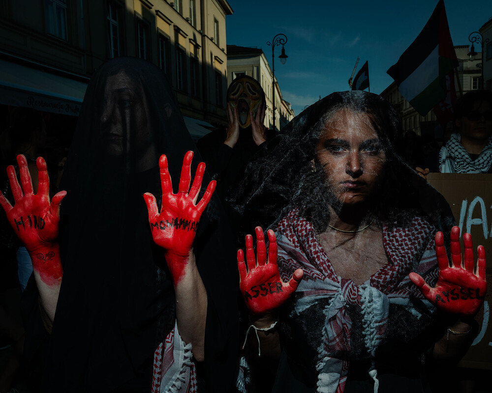 POLAND. Warsaw. 01 September 2024. Silence March in memory of the victims of genocide in Gaza strip. Protresters with names of killed Palestinians on the palms of their hands