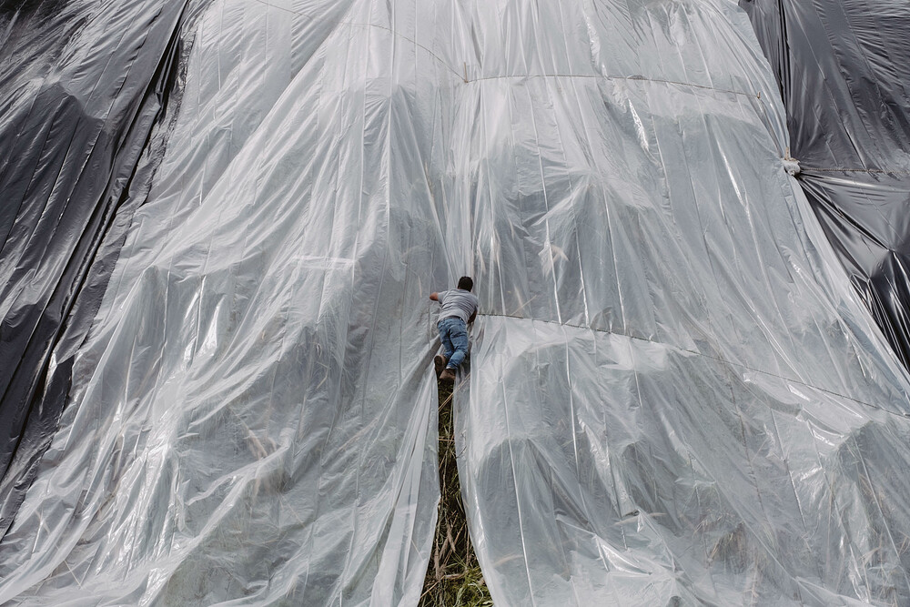 Workers put down large plastic tarps to cover the side of a hill in the Baldwin Hills neighborhood of Los Angeles on Sunday, Feb. 18, 2024, in preparation for heavy rains and potential flooding. (Mark Abramson/The New York Times) Workers put down large plastic tarps to cover the side of a hill in the Baldwin Hills neighborhood of Los Angeles on Sunday, Feb. 18, 2024, in preparation for heavy rains and potential flooding. (Mark Abramson/The New York Times)