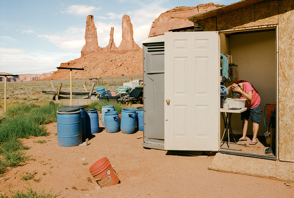 Linda Jackson washes her hair at her home in the Navajo Nation on July 11.