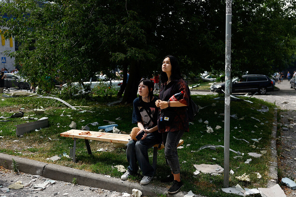 Women react near a building damaged during Russian missile strike, in Kyiv Women react near a building damaged during Russian missile strike, in Kyiv